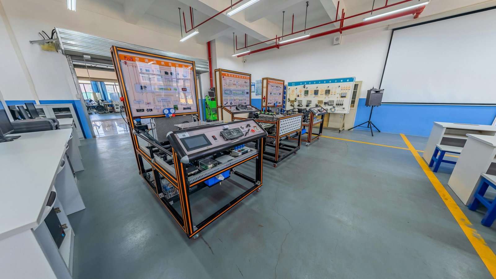 drain-cleaning Spacious engineering laboratory equipped with advanced training systems and desks.