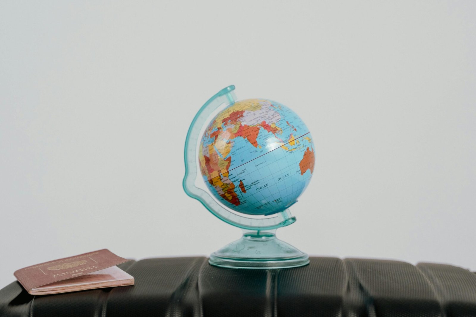 gas-pipeline A globe and passport on a suitcase, symbolizing travel planning and wanderlust.